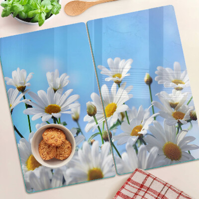 Tábua para corte Flores de margarida em um fundo azul