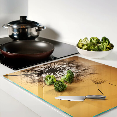 Tábua para corte Dentes-de-leão contra o fundo do pôr do sol