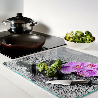 Tábua para cozinha Flores e pedras contra o fundo da água