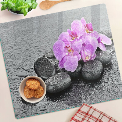 Tábua para cozinha Flores e pedras contra o fundo da água