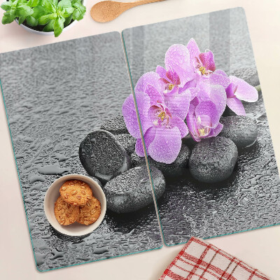 Tábua para cozinha Flores e pedras contra o fundo da água