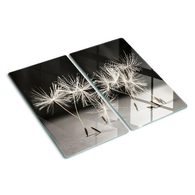 Tábua para cozinha Dentes-de-leão fofos em um fundo monocromático