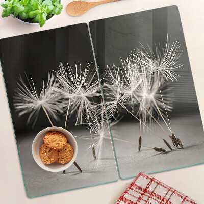 Tábua para cozinha Dentes-de-leão fofos em um fundo monocromático