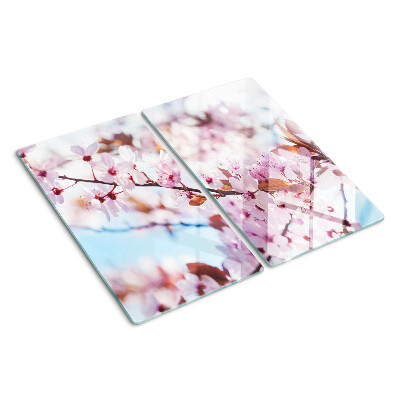 Tábua para corte Flores de cerejeira em um fundo azul