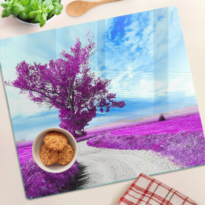 Tábua para corte Uma árvore roxa contra o céu