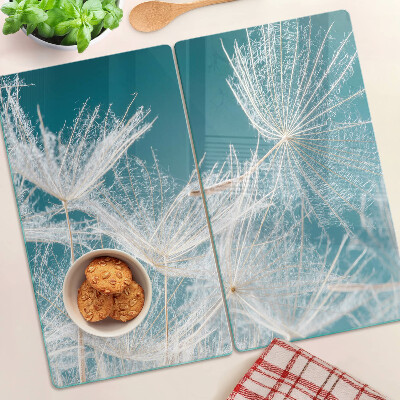 Tábua para corte Dente-de-leão em um fundo azul
