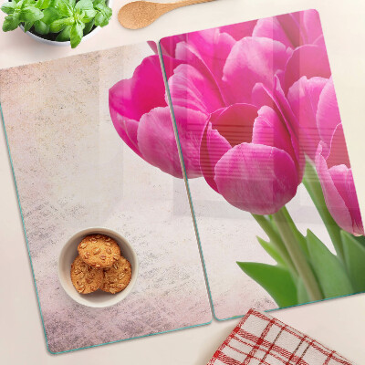 Tábua para corte Flores de tulipa em um fundo rosa