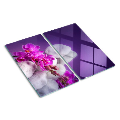 Tábua para cozinha Flores de orquídea em um fundo de pedras