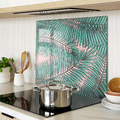 Tábua para cozinha Folhas de palmeira em um fundo rosa
