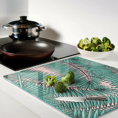 Tábua para cozinha Folhas de palmeira em um fundo rosa