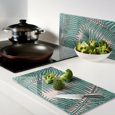 Tábua para cozinha Folhas de palmeira em um fundo rosa