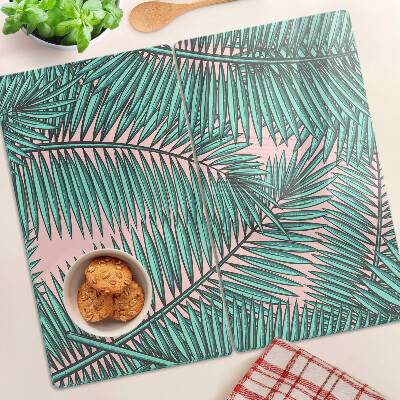 Tábua para cozinha Folhas de palmeira em um fundo rosa