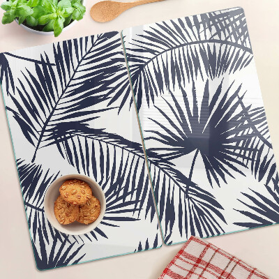 Tábua para corte Folhas de palmeira em um fundo branco