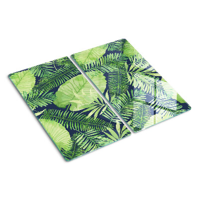 Tábua para corte Folhas tropicais em um fundo escuro