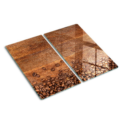 Tábua para corte Grãos de café em um fundo de madeira