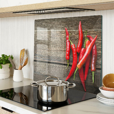 Tábua para cozinha Pimentas em um fundo de madeira