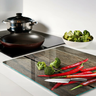 Tábua para cozinha Pimentas em um fundo de madeira