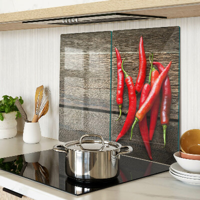 Tábua para cozinha Pimentas em um fundo de madeira