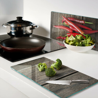 Tábua para cozinha Pimentas em um fundo de madeira