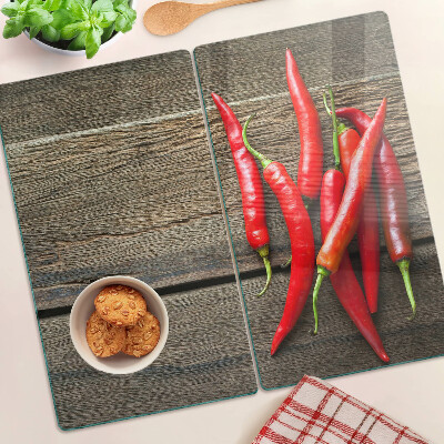 Tábua para cozinha Pimentas em um fundo de madeira