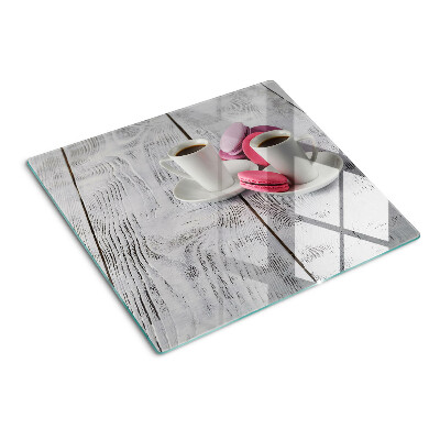 Tábua para cozinha Café e macarons em um fundo de madeira