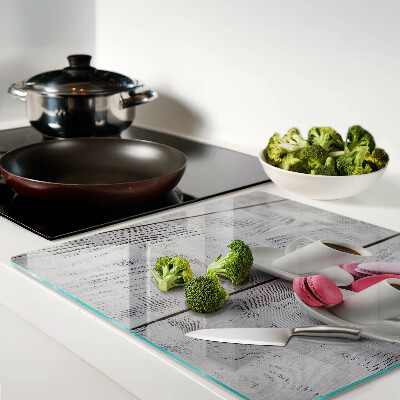 Tábua para cozinha Café e macarons em um fundo de madeira