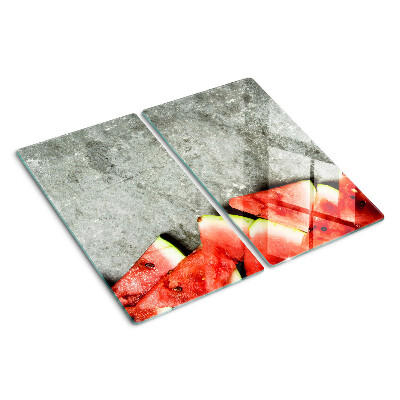 Tábua para corte Fatias de melancia em um fundo cinza