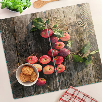 Tábua para corte Maçãs em um fundo de madeira
