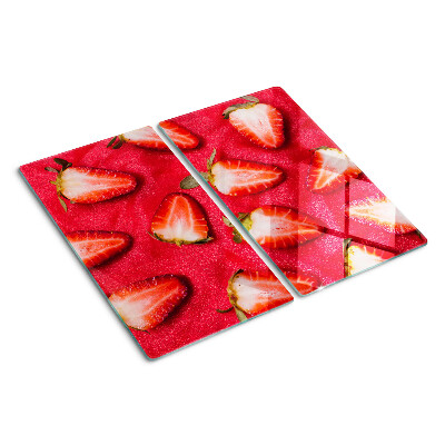 Tábua para corte Morangos em um fundo rosa