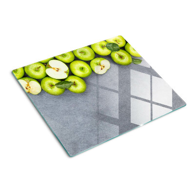 Tábua para cozinha Maçãs verdes em uma superfície cinza