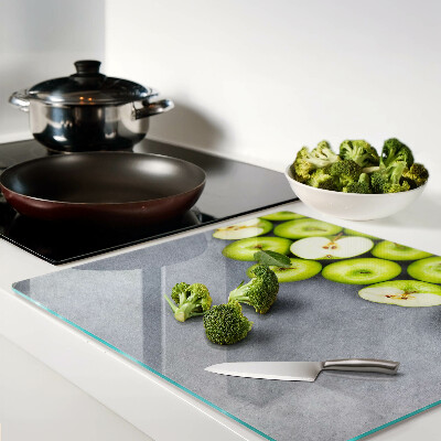 Tábua para cozinha Maçãs verdes em uma superfície cinza