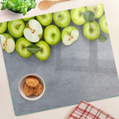 Tábua para cozinha Maçãs verdes em uma superfície cinza