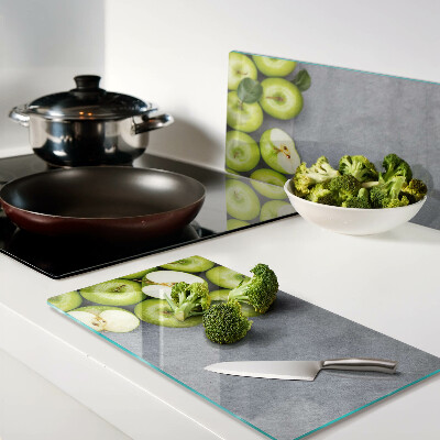 Tábua para cozinha Maçãs verdes em uma superfície cinza