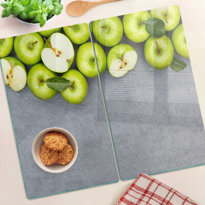 Tábua para cozinha Maçãs verdes em uma superfície cinza