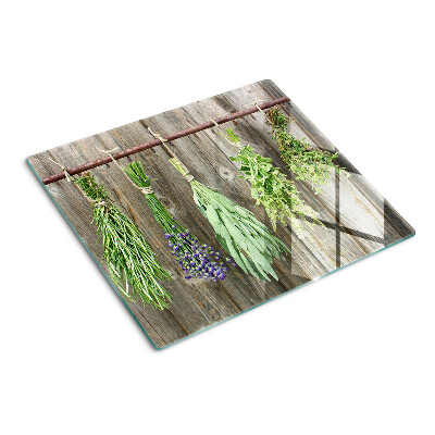 Tábua para cozinha Ervas em um fundo de madeira