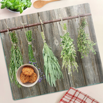 Tábua para cozinha Ervas em um fundo de madeira