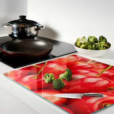 Tábua para corte Cerejas em fundo vermelho