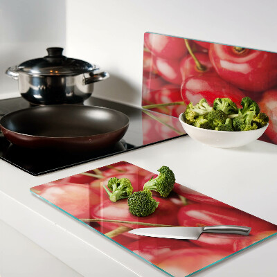 Tábua para corte Cerejas em fundo vermelho