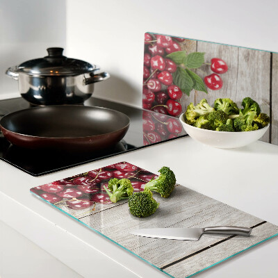 Tábua para cozinha Cerejas em um fundo de madeira