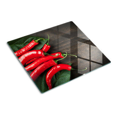 Tábua para cozinha Pimentas em um fundo de madeira