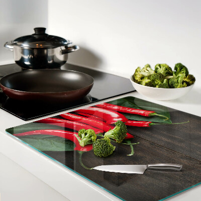 Tábua para cozinha Pimentas em um fundo de madeira