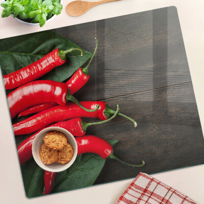 Tábua para cozinha Pimentas em um fundo de madeira