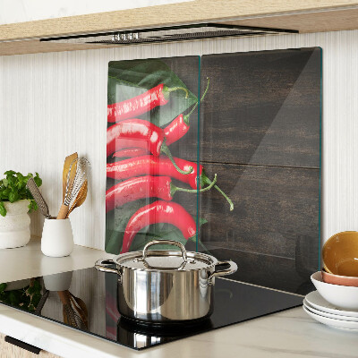 Tábua para cozinha Pimentas em um fundo de madeira