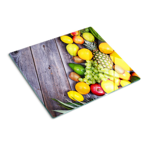 Tábua para cozinha Frutas em um fundo de madeira