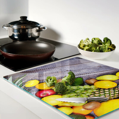 Tábua para cozinha Frutas em um fundo de madeira