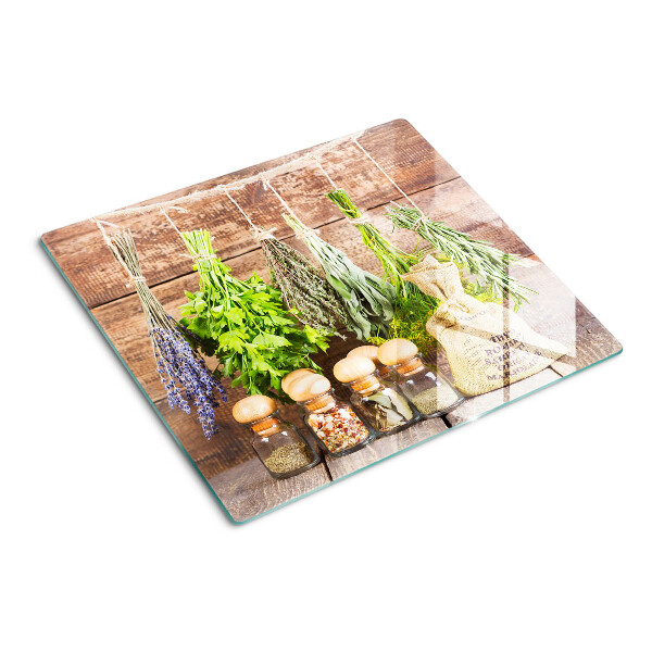 Tábua para corte Ervas e especiarias em um fundo de madeira