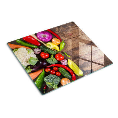 Tábua para cozinha Legumes em um fundo de madeira