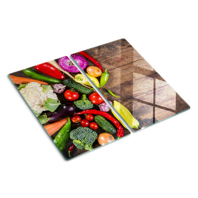 Tábua para cozinha Legumes em um fundo de madeira