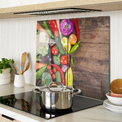 Tábua para cozinha Legumes em um fundo de madeira