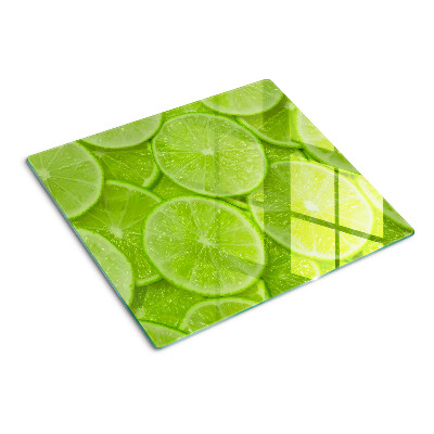 Tábua para cozinha Fatias de limão em um fundo verde